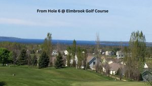 Explore Traverse City’s top golf courses & unwind at our cozy vacation rental—your perfect home base for a Northern Michigan golf getaway! View of East Bay from hole 6 at Elmbrook Golf Course