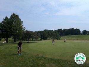 Patrick, Anna and Bray practicing their putting