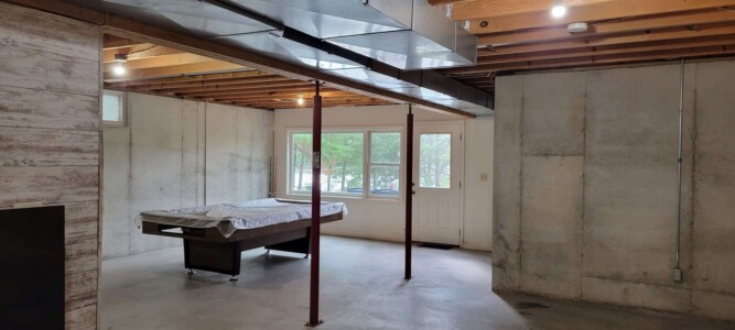 Pool table in lower level of Dyer Lake Vacation Home
