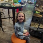 Annabella holding a rat at Cognitions in Beulah